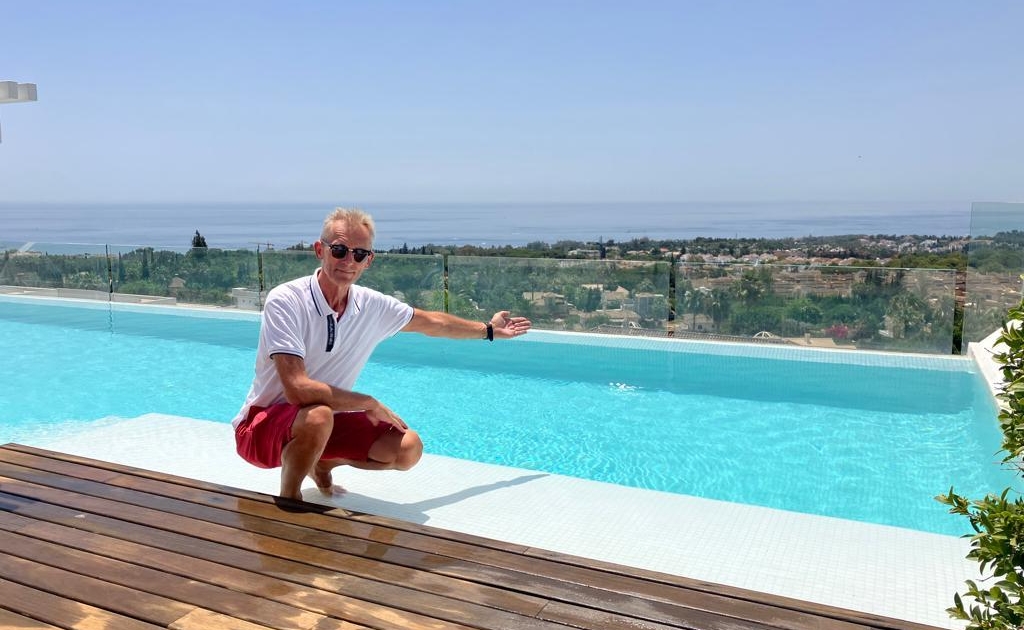 Goran Eriksson member of the Marbella team next to a pool